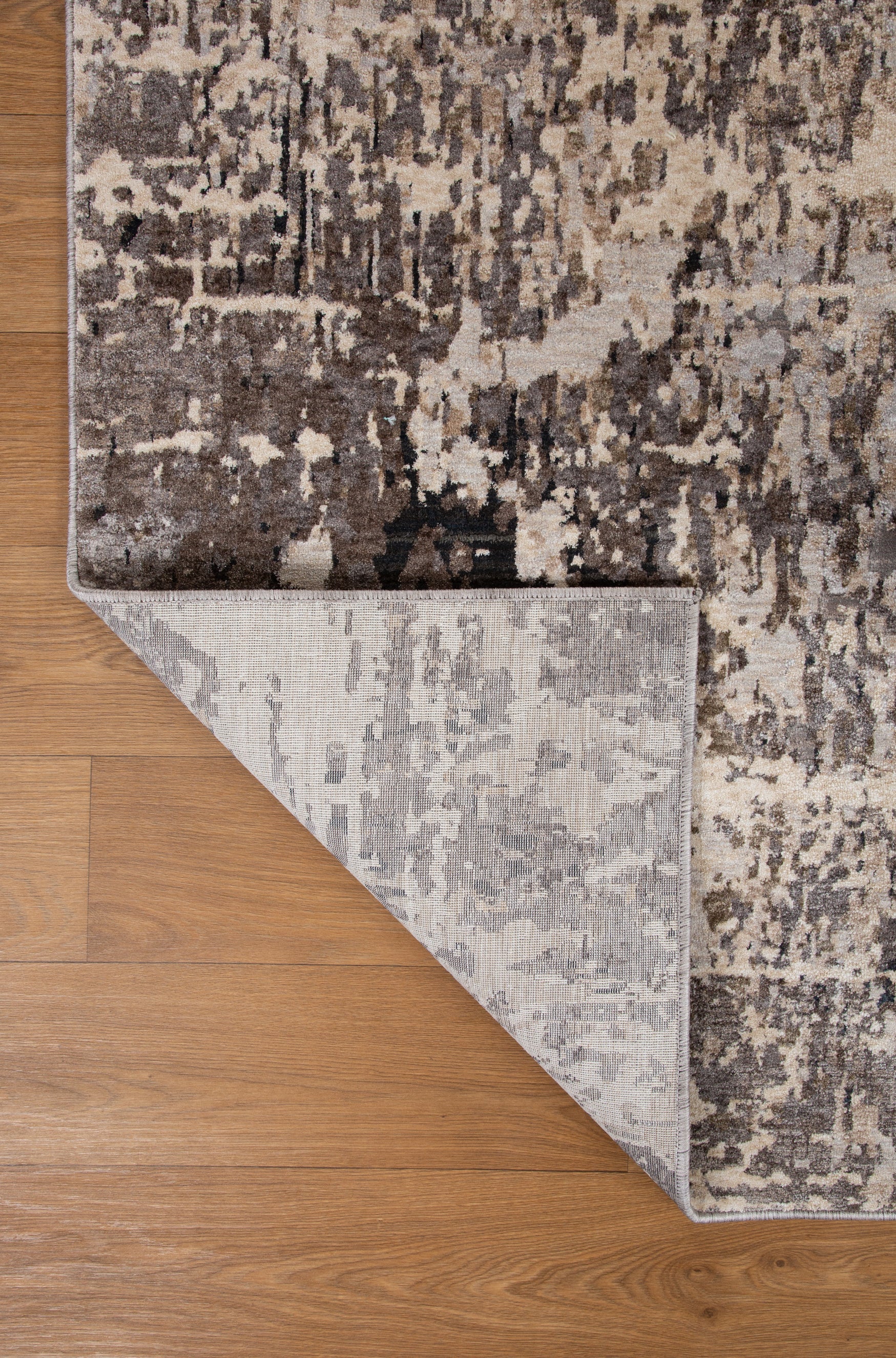 Modern distressed area rug with grey and cream abstract texture pattern