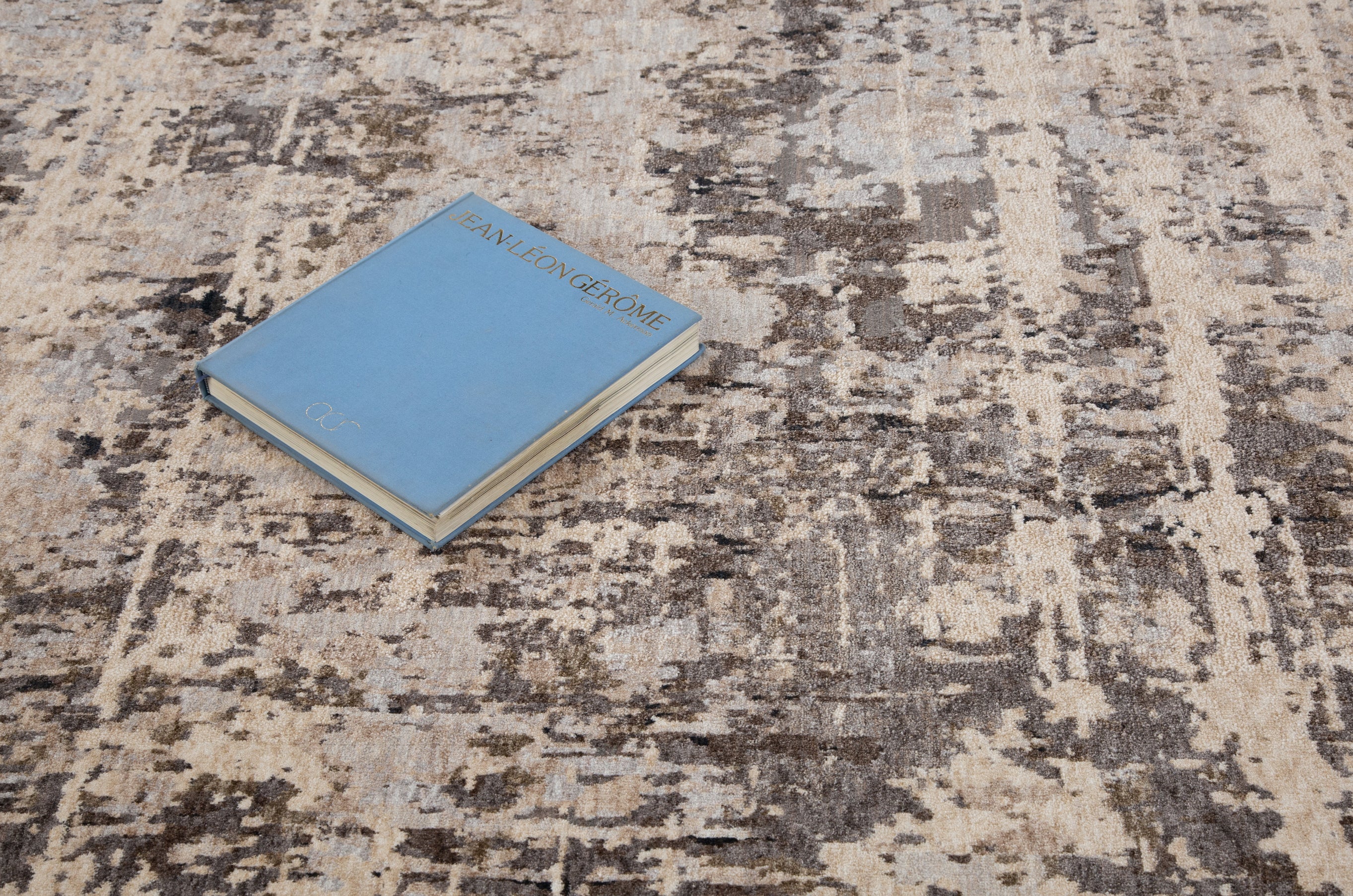Modern distressed area rug with grey and cream abstract texture pattern