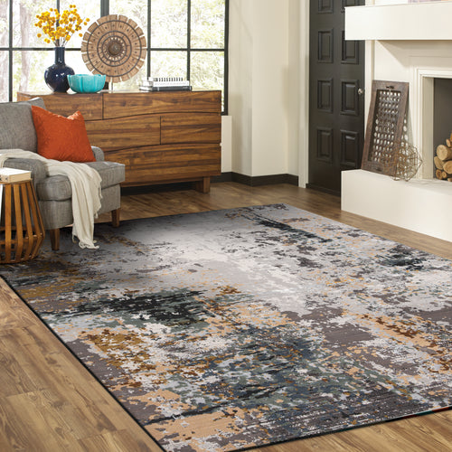 Abstract distressed rug with gold, gray, and black splatter pattern design