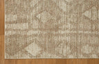 Beige and tan textured rug with subtle diamond pattern throughout