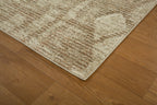 Beige and tan textured rug with subtle diamond pattern throughout