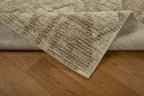 Beige and tan textured rug with subtle diamond pattern throughout