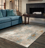Abstract distressed rug with blue, gold, and cream tones in modern design