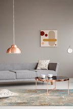 Abstract distressed rug with blue, gold, and cream tones in modern design