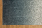 Dark grey to light grey ombre wool rug with speckled texture