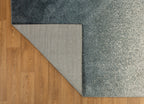 Dark grey to light grey ombre wool rug with speckled texture
