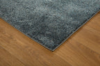 Dark grey to light grey ombre wool rug with speckled texture
