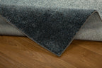 Dark grey to light grey ombre wool rug with speckled texture