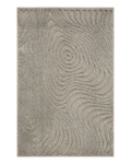 Beige quilted area rug with geometric pattern on wooden floor, corner detail