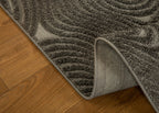 Gray textured rug with swirling abstract botanical pattern design