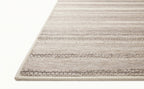 Neutral striped outdoor rug in beige and grey tones on patio