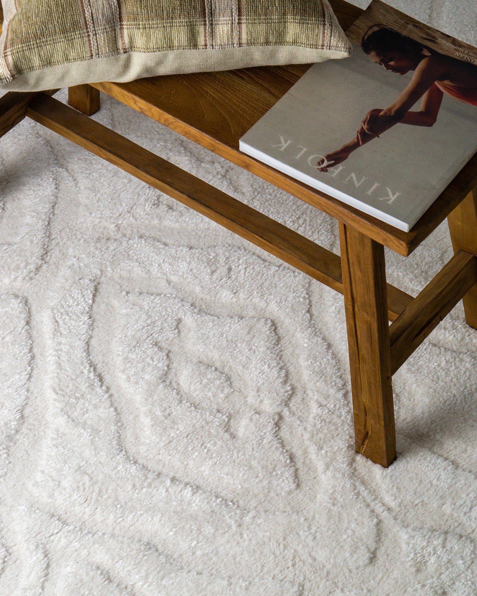 Cream textured rug with subtle geometric diamond pattern throughout