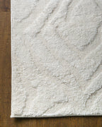 Cream textured rug with subtle geometric diamond pattern throughout