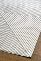 Modern geometric rug with grey and white striped pattern in contemporary design