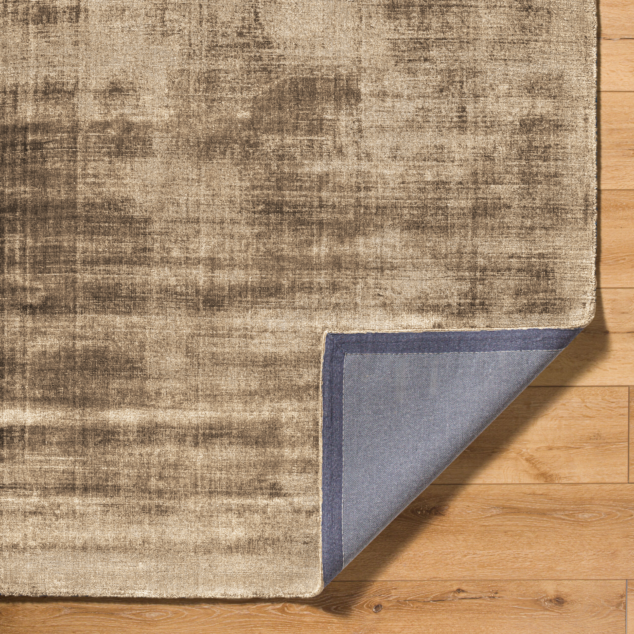 Neutral beige textured rug with distressed abstract pattern and vintage worn finish