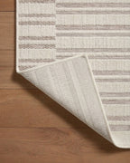 Beige and taupe striped area rug with geometric block pattern design
