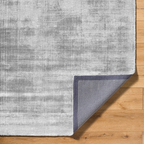 Modern grey abstract textured rug with subtle distressed pattern and soft finish