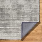 Contemporary grey textured area rug with subtle distressed pattern throughout
