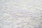 Distressed grey and lavender rug with mottled vintage texture