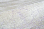 Distressed grey and lavender rug with mottled vintage texture