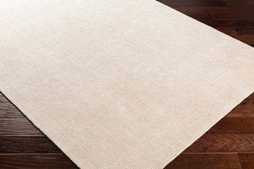 Cream textured wool area rug with natural woven pattern and soft neutral tone