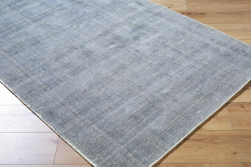Gray and white textured area rug with subtle woven pattern design