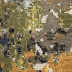 Modern abstract area rug with distressed gold, gray, and blue speckled pattern