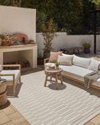 Beige and taupe striped area rug with geometric block pattern design