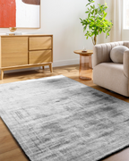 Modern grey abstract textured rug with subtle distressed pattern and soft finish