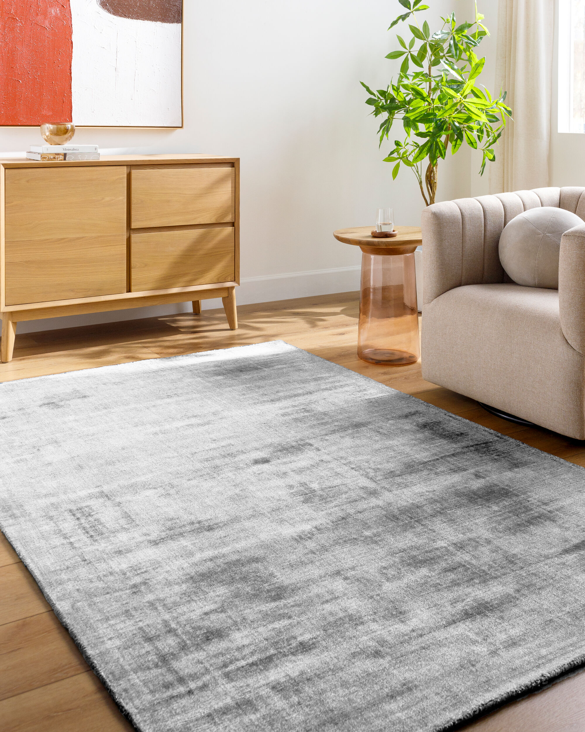 Modern grey abstract textured rug with subtle distressed pattern and soft finish