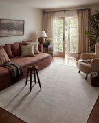 Neutral beige herringbone textured rug with subtle woven pattern throughout