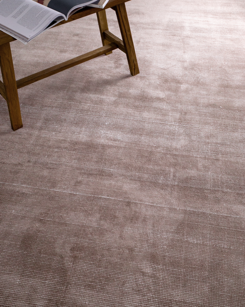 Soft taupe velvet rug with subtle texture and minimalist design