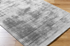 Modern grey abstract textured rug with subtle distressed pattern and soft finish