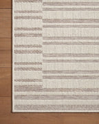 Beige and taupe striped area rug with geometric block pattern design