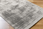Contemporary grey textured area rug with subtle distressed pattern throughout