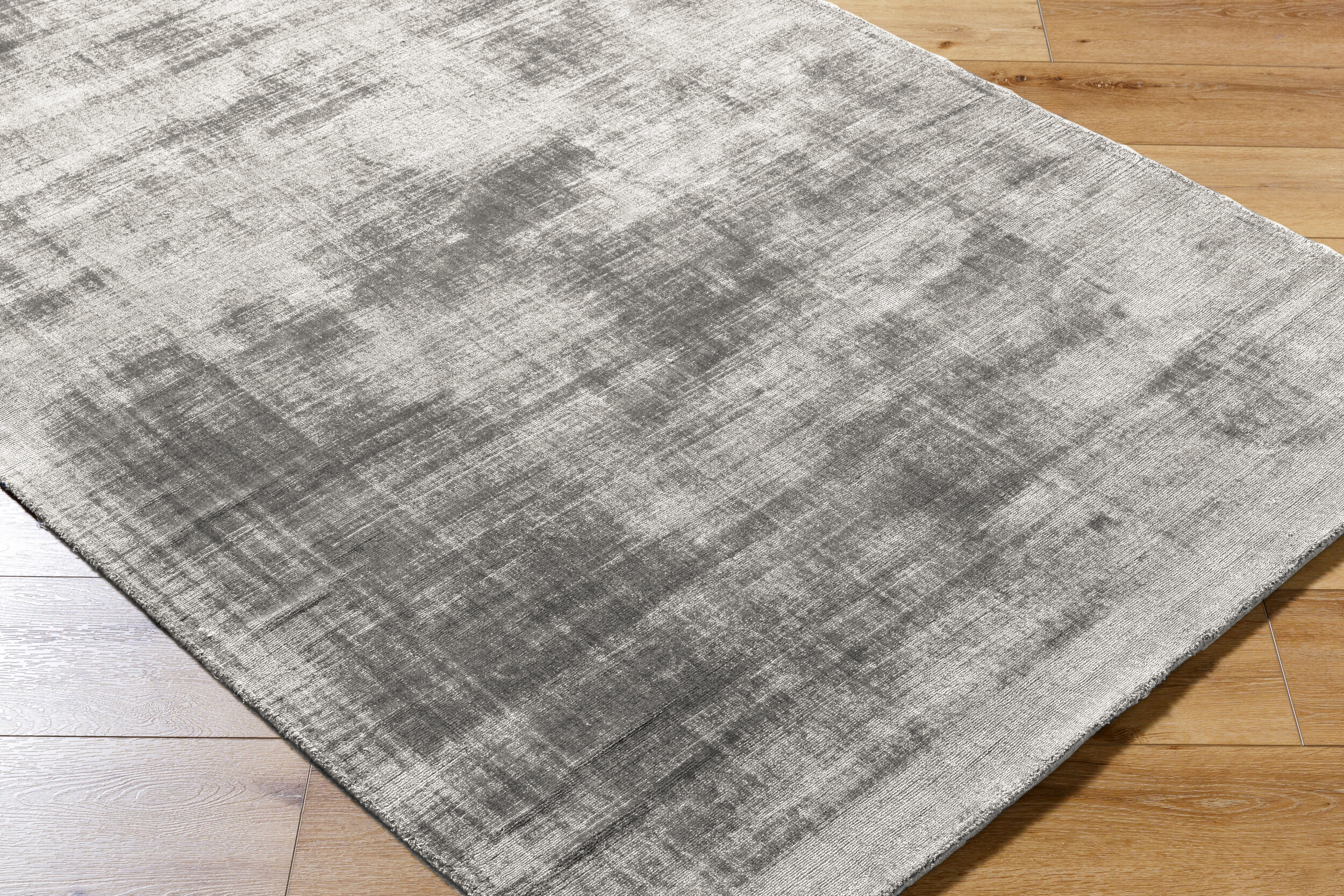 Contemporary grey textured area rug with subtle distressed pattern throughout