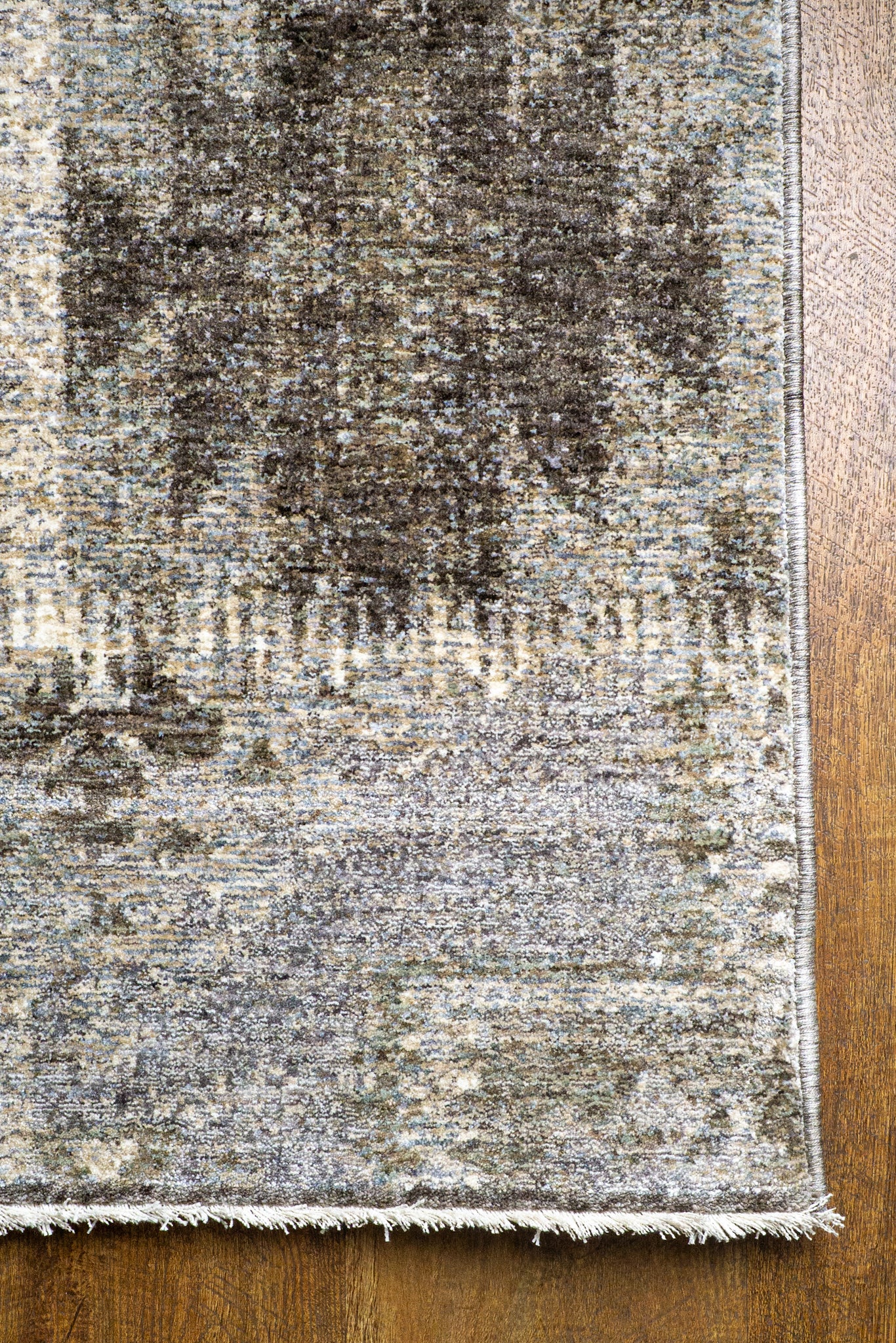 Vintage patchwork rug with geometric patterns in gray and cream tones