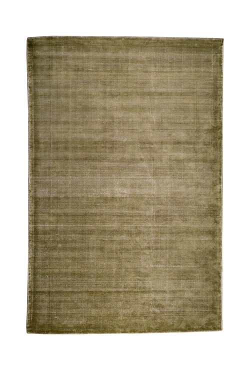 Sage green velvet rug with subtle texture and solid mottled pattern