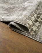 Vintage patchwork rug with geometric patterns in gray and cream tones