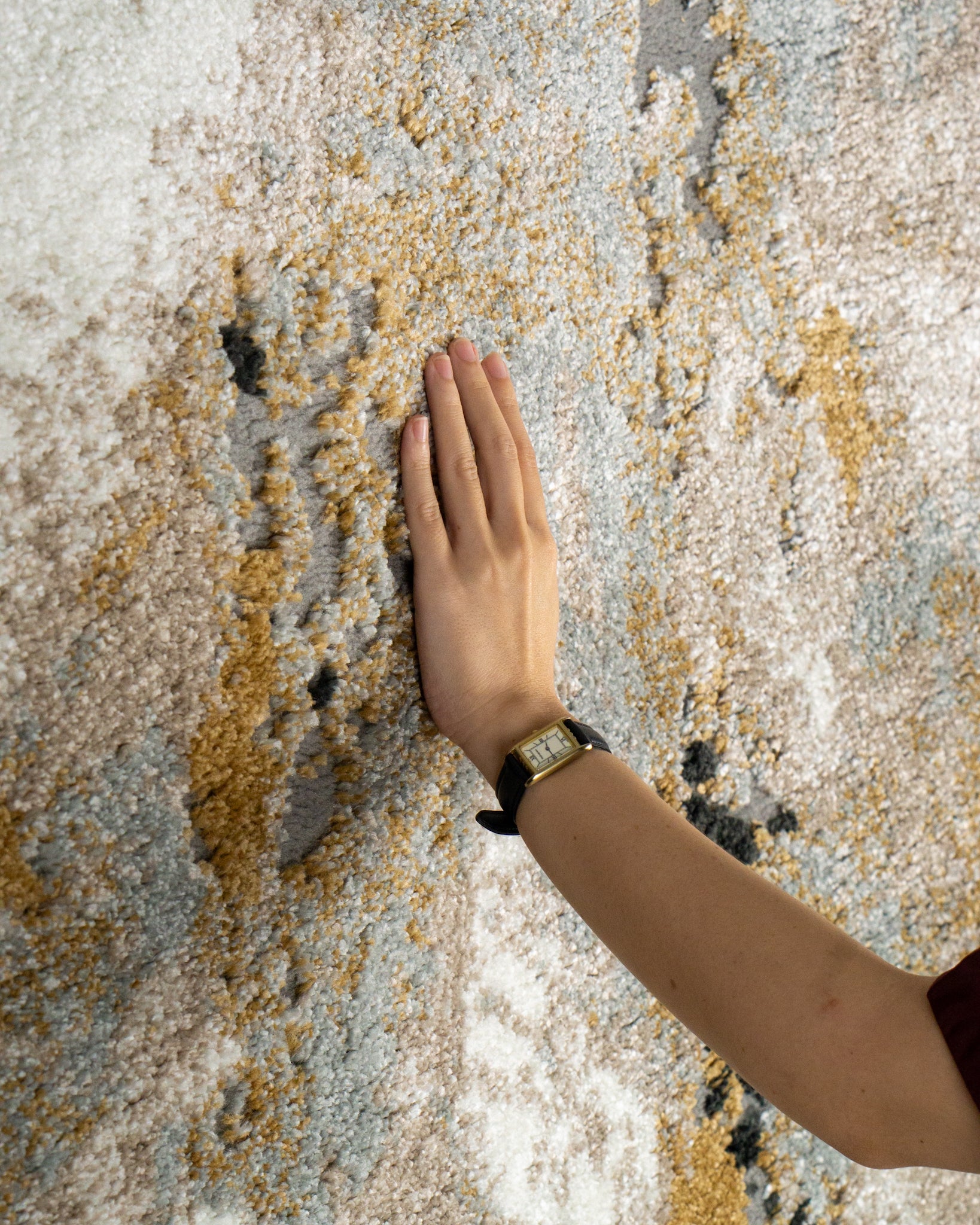 Modern abstract rug with distressed texture in grey, beige, gold and black tones