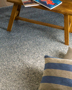 Dark grey to light grey ombre wool rug with speckled texture