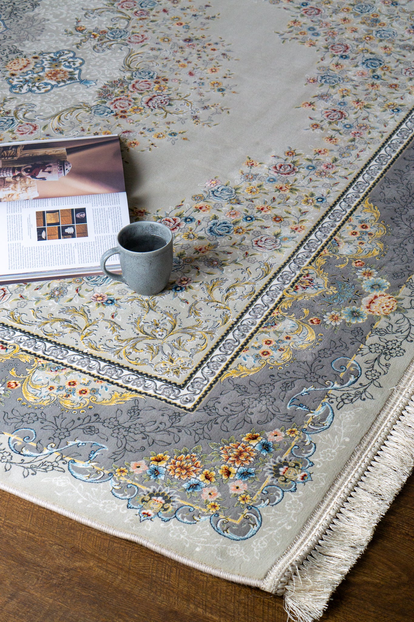 Ornate traditional rug with blue and cream floral medallion pattern and detailed border