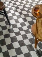 Charcoal and cream checkered wool rug with textured woven pattern