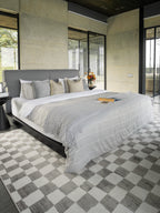 Charcoal and cream checkered wool rug with textured woven pattern