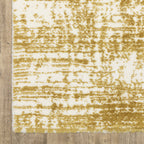 Gold and white distressed texture rug with abstract horizontal pattern
