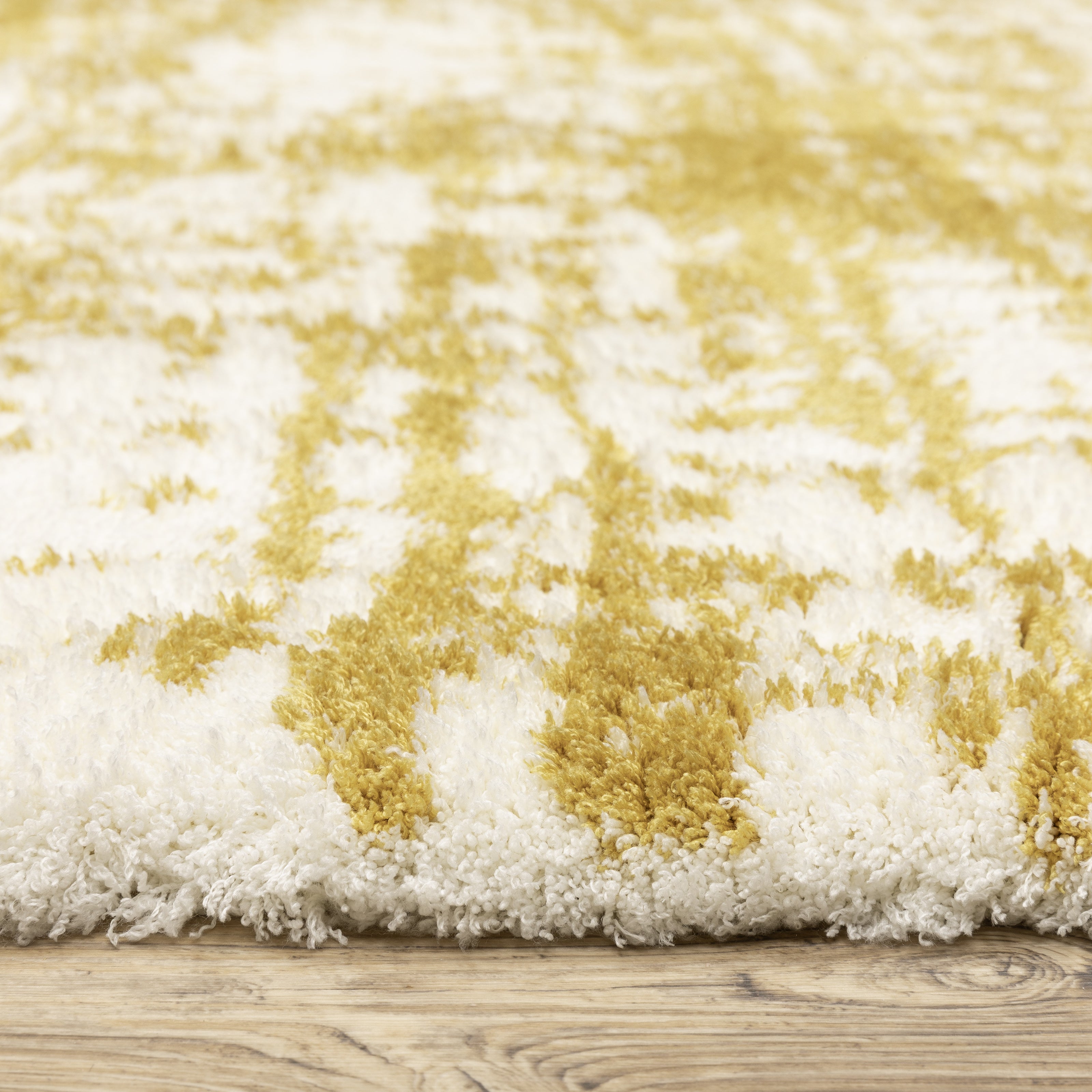 Gold and white distressed texture rug with abstract horizontal pattern