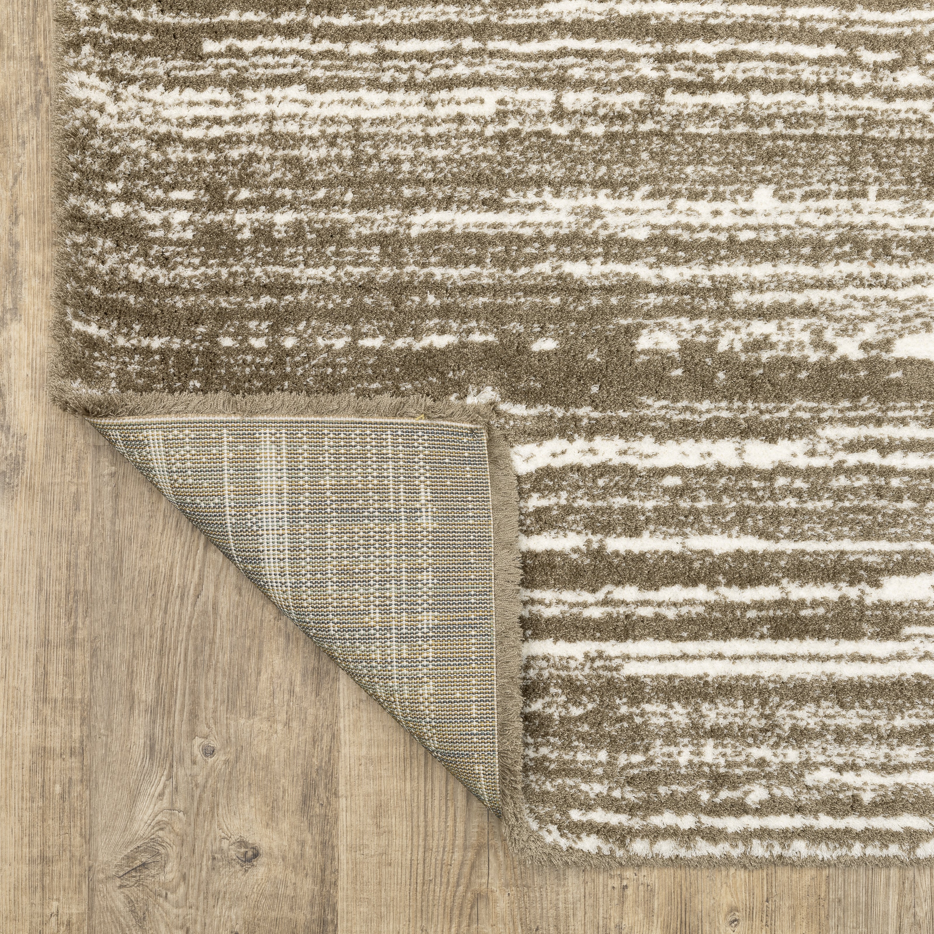 Brown and cream striped texture rug with horizontal woven pattern