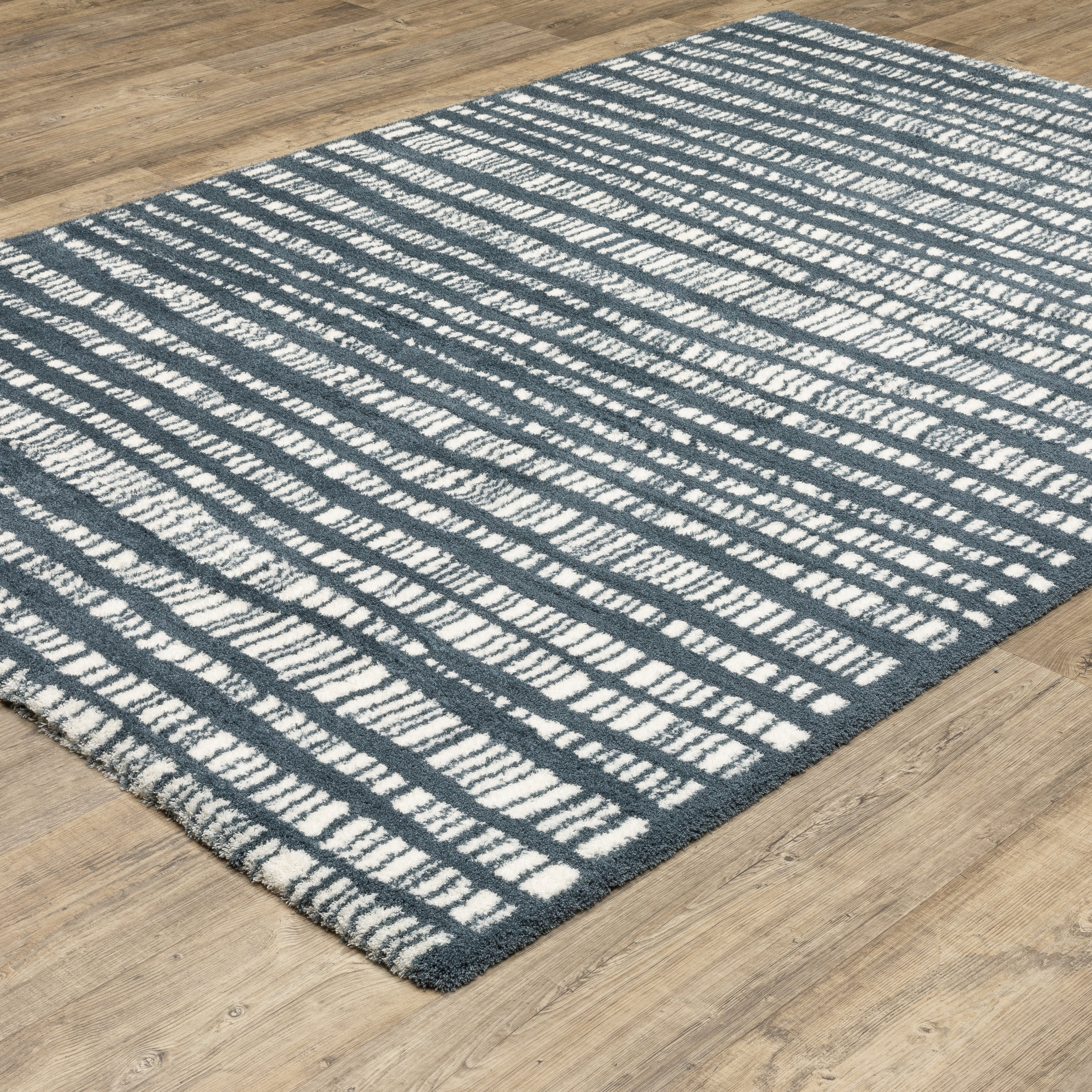 Teal and white striped wool rug with textured horizontal pattern detail