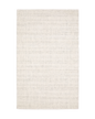 Cream textured wool rug on light wood flooring with visible weave pattern