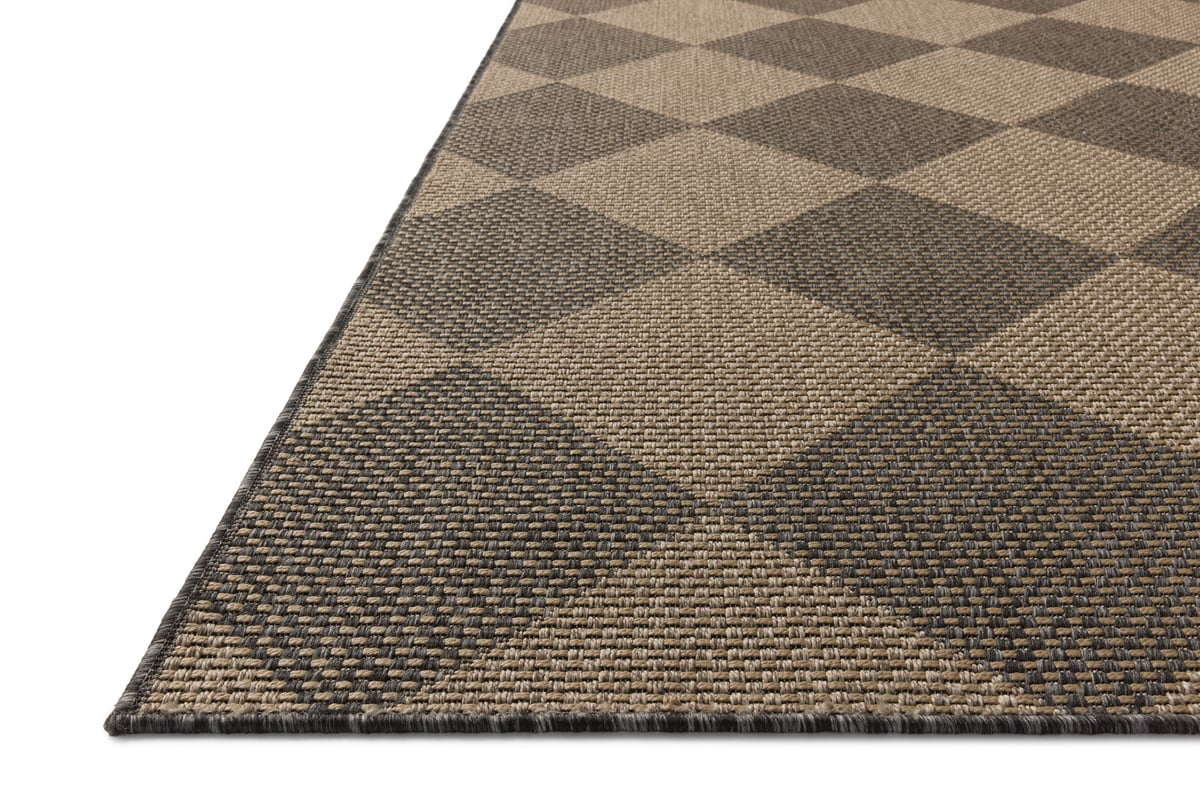 Natural fiber rug with geometric diamond pattern in tan and charcoal